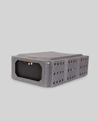 Cackle Box™ - 7" Durable Roto-Molded Transport Container for Pheasants & Game Birds shown from the side, featuring a one-way door system and ventilation holes for safe bird transport.