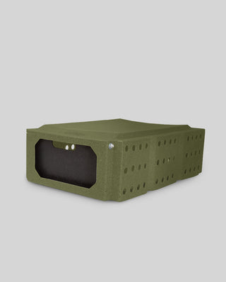 7" Olive Drab CackleBox™ - Durable Roto-Molded Transport Container for Pheasants & Game Birds shown from the side, featuring a one-way door system and ventilation holes for safe bird transport.