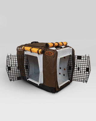 RuffLand® Kennel Cover in brown installed on intermediate kennel with doors open.