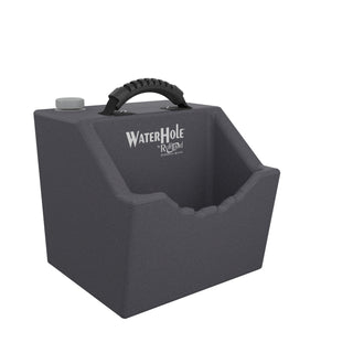 Angled view of the Water Hole™ water dish by RuffLand, featuring a dark gray body and accessible drinking area for dogs.