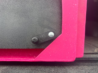 Close-up view of CackleBox™ latch installed on a hot pink CackleBox™, right side unlatched