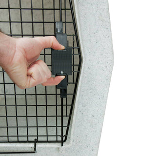 A user demonstrating the Click's Easy Squeeze kit in action while gripping the kennel door, emphasizing the ease of operation.
