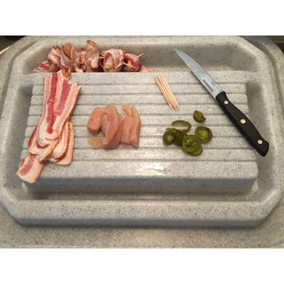 Bacon, chicken, and jalapeños neatly arranged on a Clean Cut® station, alongside a knife.